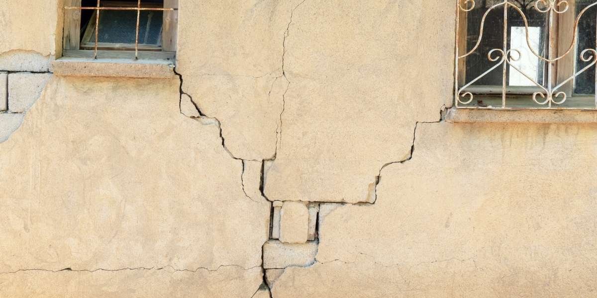 Common render problems found in Bradford properties including cracks, bulging and weather damage